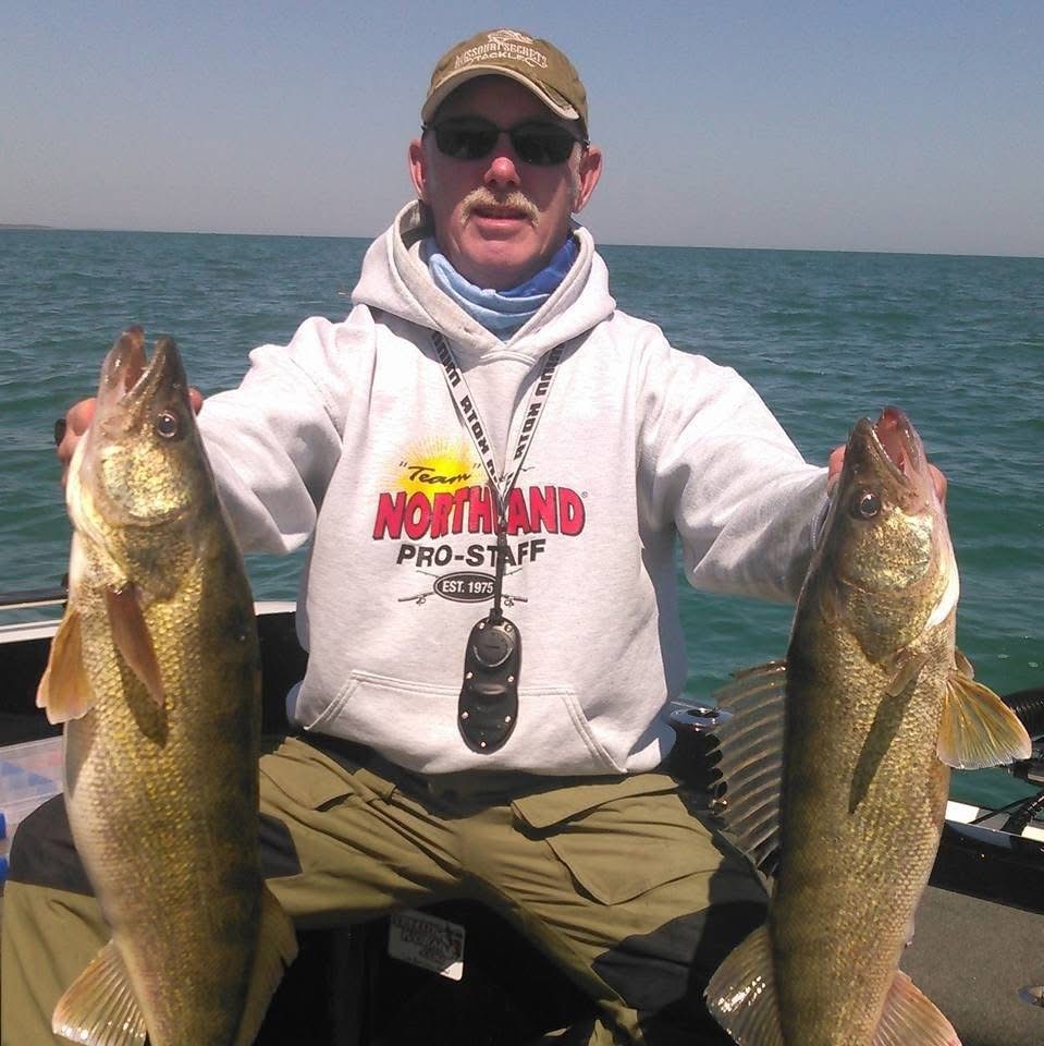 Wade While, owner and walleye fishing guide at Wade's Lake Oahe Adventures, with walleyes on Lake Oahe