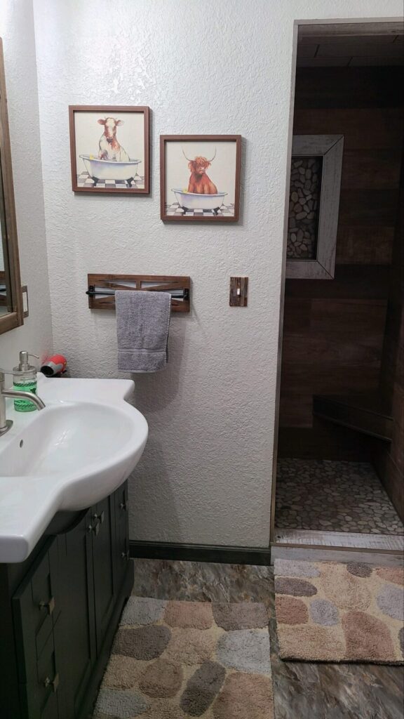 Guest bathroom with a tiled walk-in shower at the Lazy A Ranch